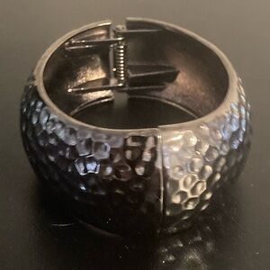 Silver tone bracelet with hinge